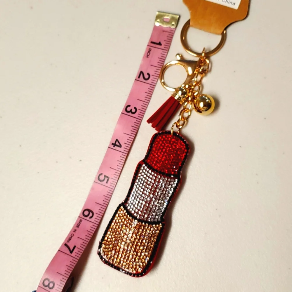Red lipstick rhinestone covered keychain with ball and tassel goldtone Chic